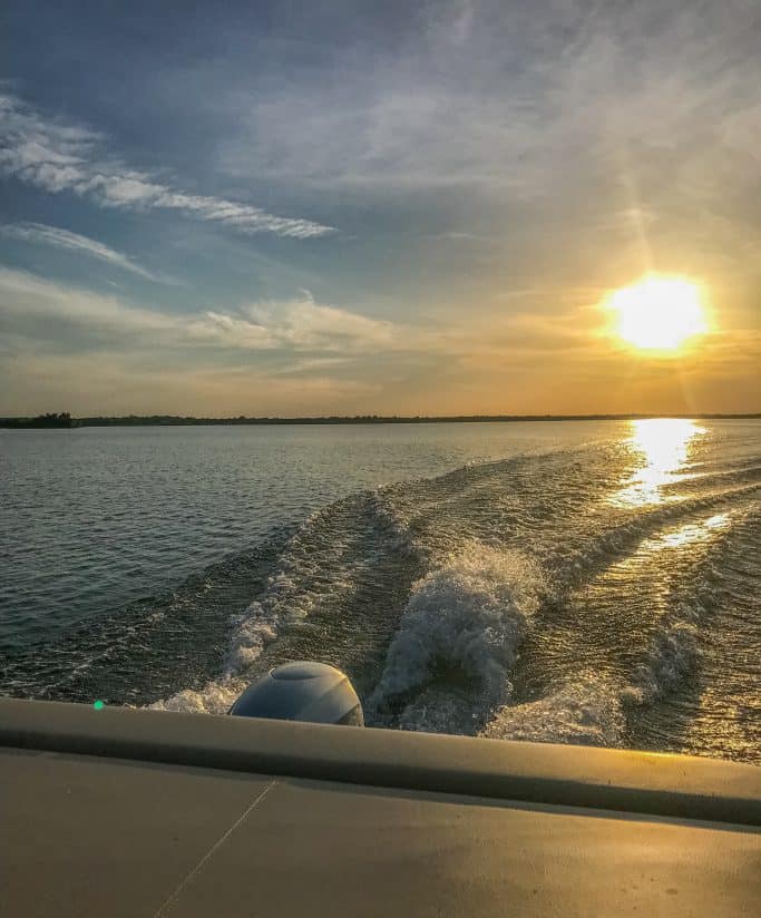 Image taken of the lake sunset our pontoon boat. Available for rent exclusively for Cedar Lodge Texas guests.