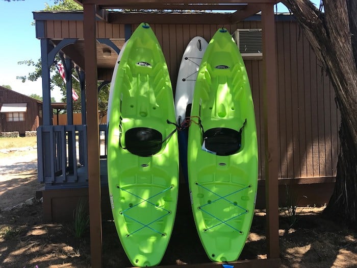 Image of kayak rentals at Cedar Lodge Texas. Best cabin rentals Texas. We offer daily boat rentals to guests of our Hill Country Resort. Best family friendly cabin rentals in Texas are here.