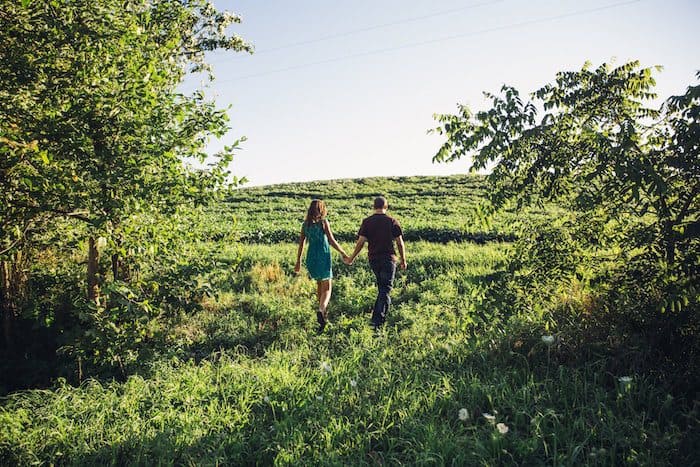 Image of couple walking through Texas Hill Country during their romantic getaway at the lake