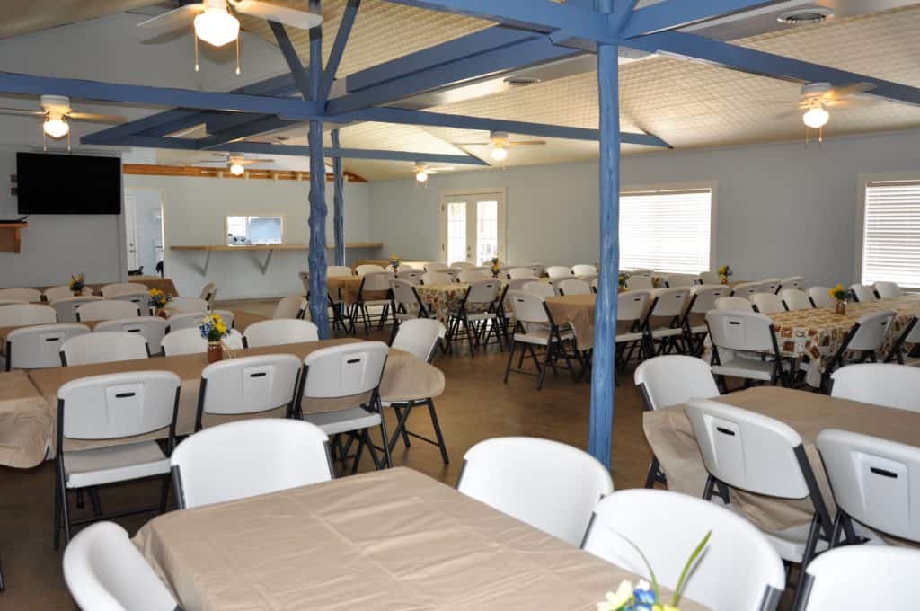 Image of Meeting Hall interior at Cedar Lodge. Best Hill Country Resort and best venue for work retreats in Texas. We have Texas cabin rentals and large gathering halls for family reunions in Texas.