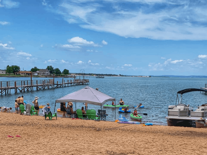 Image of guests enjoying the sandy beach at our Texas Hill country cabins