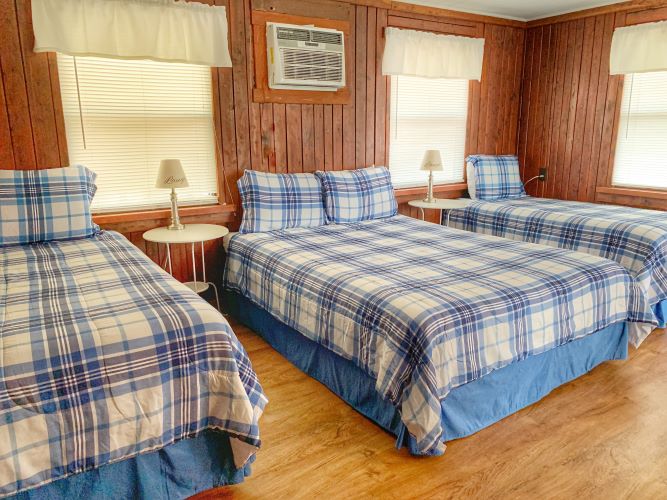 Cabin 24 Interior (1 Queen Bed and 2 Single Beds)
