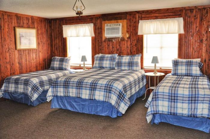 Cabin 32 Interior (1 Queen Bed and 2 Single Beds)