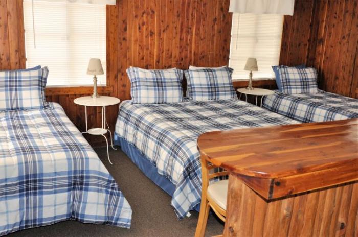 Cabin 34 Interior (1 Queen Bed and 2 Single Beds)